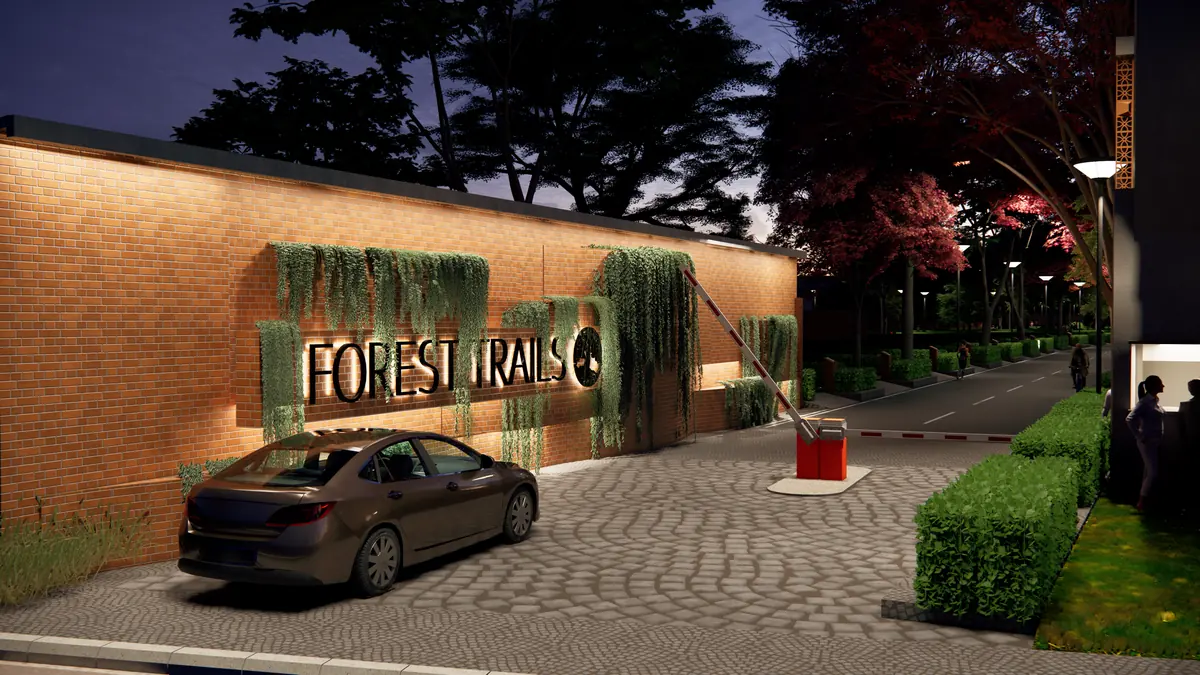 The Forest Trails entrance wall lit at night